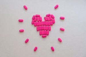 Pink Heart Shaped Medicines on White Surface
